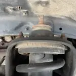 A cracked but not quite worn enough to replace top strut mount rubber