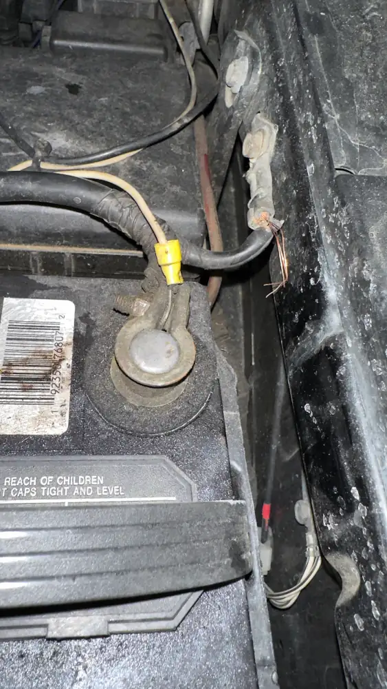 The only obvious casualty to the battery hold downs giving up was this ground strap attached to the fender.