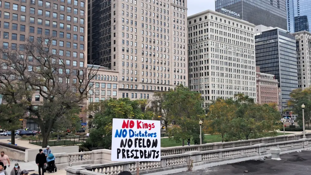 Crowd of demonstrators during a No Kings protest on Van Buren Street in Chicago on October 18, 2025.